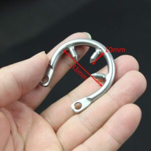hand holding ring of Extended Long Metal Chastity Cage