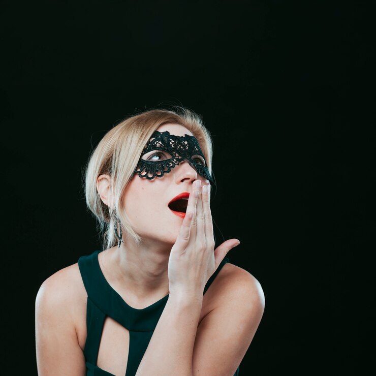 amazed-woman-dark-carnival-mask