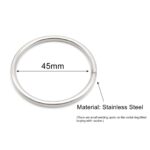 An adjustable black elastic band designed to secure a male chastity cage.