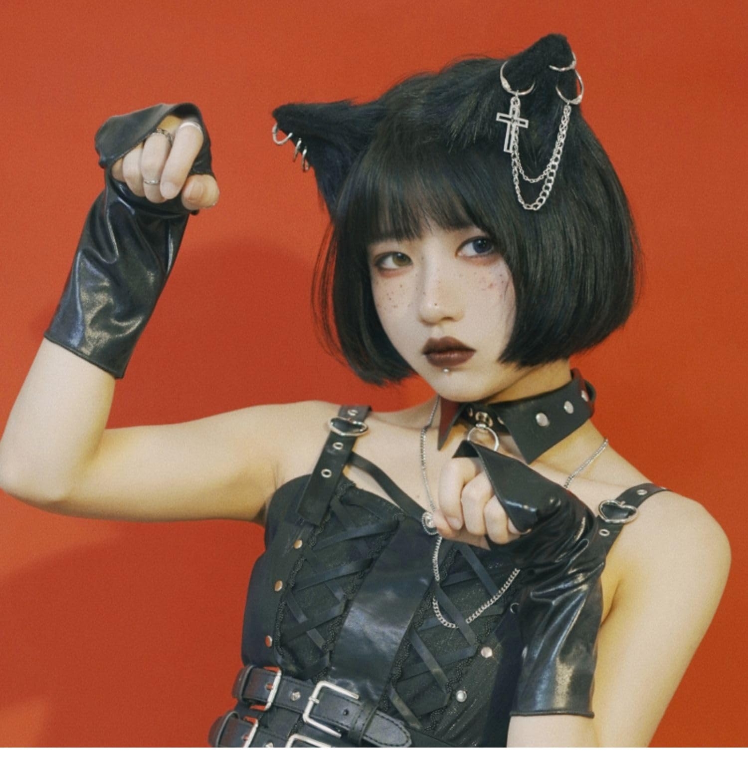 Woman in kitten play costume with cat ears and tail plug
