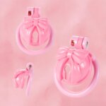 pink chastity cage bow integrated lock rings side product view