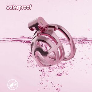 pink plastic chastity cage hidden lock adjustable detail close-up
